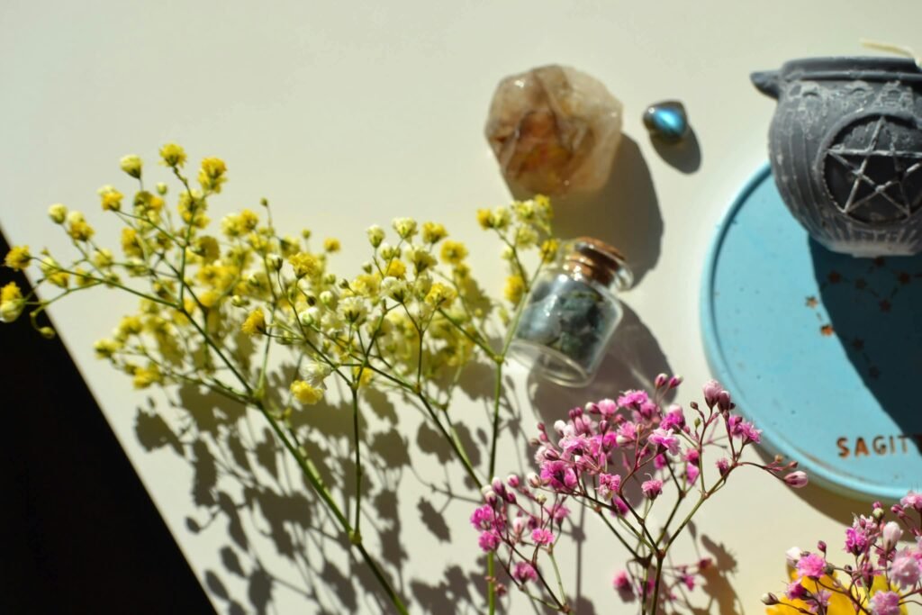 Charming flat lay depicting crystals, flowers, and astrology items, perfect for decor inspiration.